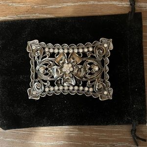 Beautiful solid perforated detailed flower, rhinestone belt buckle.